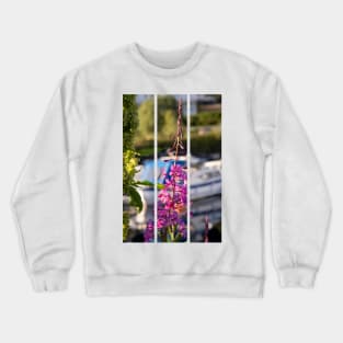 Wonderful landscapes in Norway. Blooming colorful lupine flower in Norway in the wild grass. Blur harbour background with boats. Summer sunny day (vertical) Crewneck Sweatshirt